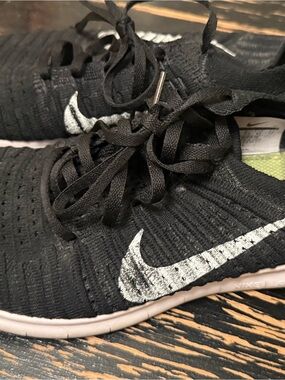 Nike Black Knit Sneakers with White Swoosh Accent
